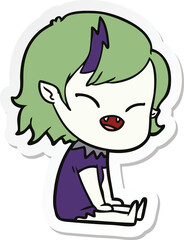 sticker of a cartoon laughing vampire girl sitting