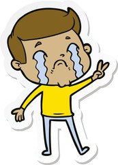 sticker of a cartoon man crying