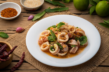 Squid Spicy Salad with Herbs,Hot and Sour Squid with Chilli, Mint leaf and Coriander in lime sauce (Yam pla muk)