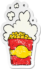 distressed sticker of a cartoon popcorn