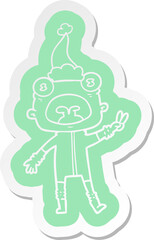 cartoon  sticker of a weird alien waving wearing santa hat
