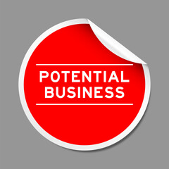 Red color peel sticker label with word potential business on gray background