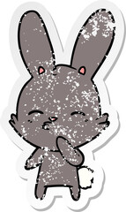 distressed sticker of a curious bunny cartoon
