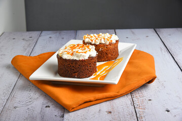Round shaped brownies with cream and lemon tart topping