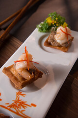 chinese banquet stir fried big tiger prawn with tofu beancurd cocktail butler canape in plate on wood table asian restaurant cafe fine dining halal menu