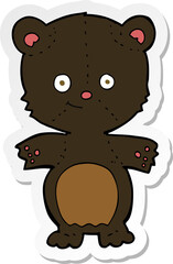 sticker of a cartoon happy black bear