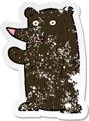 retro distressed sticker of a cartoon waving black bear
