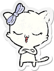 distressed sticker of a cartoon cat with bow on head