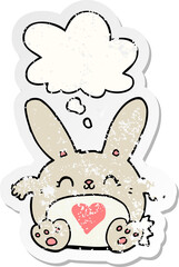 cute cartoon rabbit with love heart and thought bubble as a distressed worn sticker