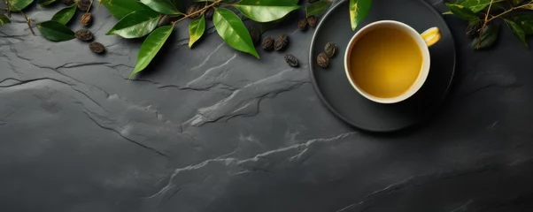 Zelfklevend Fotobehang Cup of hot tea and tea leaves on dark luxury stone background, banner. Generative Ai. © annamaria