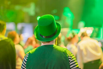 Rear view of man wearing a green national hat celebrating St. Patrick's Day