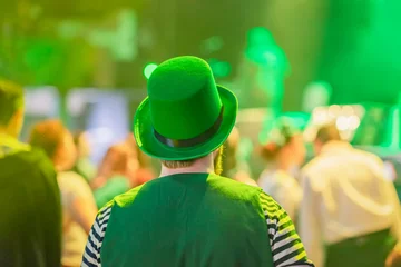 Foto op Canvas Rear view of man wearing a green national hat celebrating St. Patrick's Day © svetlanais