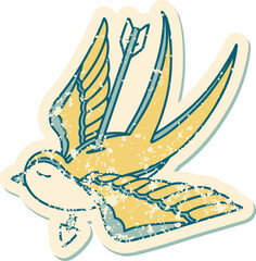 distressed sticker tattoo style icon of a swallow pieced by arrow