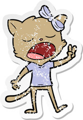distressed sticker of a cartoon yawning cat