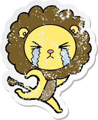 distressed sticker of a cartoon crying lion running away