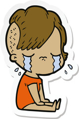 sticker of a cartoon crying girl