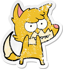 distressed sticker of a cartoon grinning fox