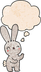 cute cartoon rabbit and thought bubble in grunge texture pattern style