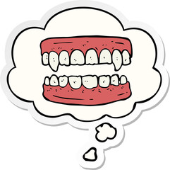cartoon vampire teeth and thought bubble as a printed sticker