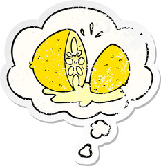 cartoon cut lemon and thought bubble as a distressed worn sticker