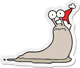 sticker cartoon of a slug wearing santa hat