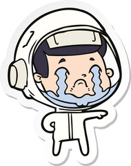sticker of a cartoon crying astronaut