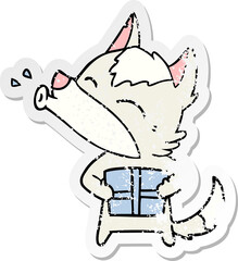 distressed sticker of a howling wolf with christmas present