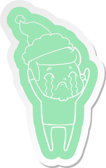 cartoon  sticker of a man crying wearing santa hat