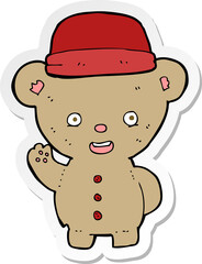 sticker of a cartoon bear in hat