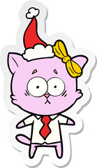 Obraz na płótnie Canvas sticker cartoon of a cat wearing santa hat