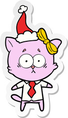 sticker cartoon of a cat wearing santa hat