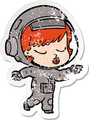 distressed sticker of a cartoon pretty astronaut girl pointing