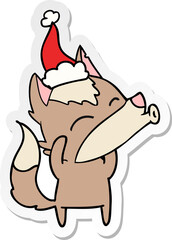 howling wolf sticker cartoon of a wearing santa hat