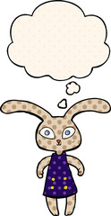 cute cartoon rabbit and thought bubble in comic book style