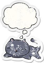 cartoon cat and thought bubble as a distressed worn sticker
