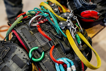 Tree climbing arborist climbing gear equipment for safety with colorful ropes and harness 