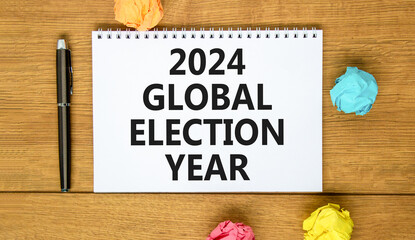 2024 global election year symbol. Concept words 2024 global election year on beautiful white note. Beautiful wooden table background. Paper. Business 2024 global election year concept. Copy space