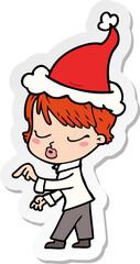 sticker cartoon of a woman with eyes shut wearing santa hat