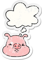 cartoon angry pig face and thought bubble as a distressed worn sticker