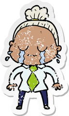 distressed sticker of a cartoon crying old lady