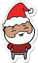sticker cartoon of a happy bearded man wearing santa hat