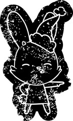 curious bunny cartoon distressed icon of a wearing santa hat