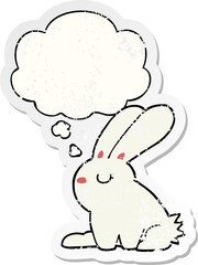 cartoon rabbit and thought bubble as a distressed worn sticker