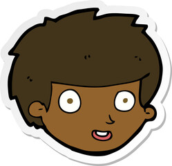 sticker of a cartoon happy boys face