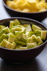 chopped zucchini in bowl close-up