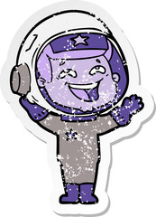 distressed sticker of a cartoon laughing astronaut