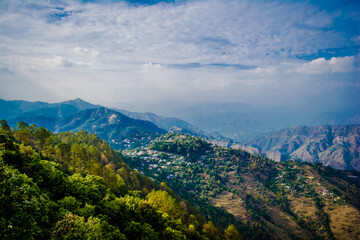 Fototapeta na wymiar Beautiful Green Mountains and valleys of Lansdowne in the district of Garhwal, Uttarakhand. Lansdown Beautiful Hills. The beauty of nature on the hills of Uttrakhand.