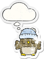cute cartoon owl in hat and thought bubble as a distressed worn sticker