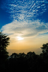 Sunset view from the mountains of Lansdowne. Mountain Sunset view in Lansdowne. Amazing  golden sunset seen through forest drive, Lansdowne Uttarakhand.