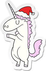 sticker cartoon of a unicorn wearing santa hat